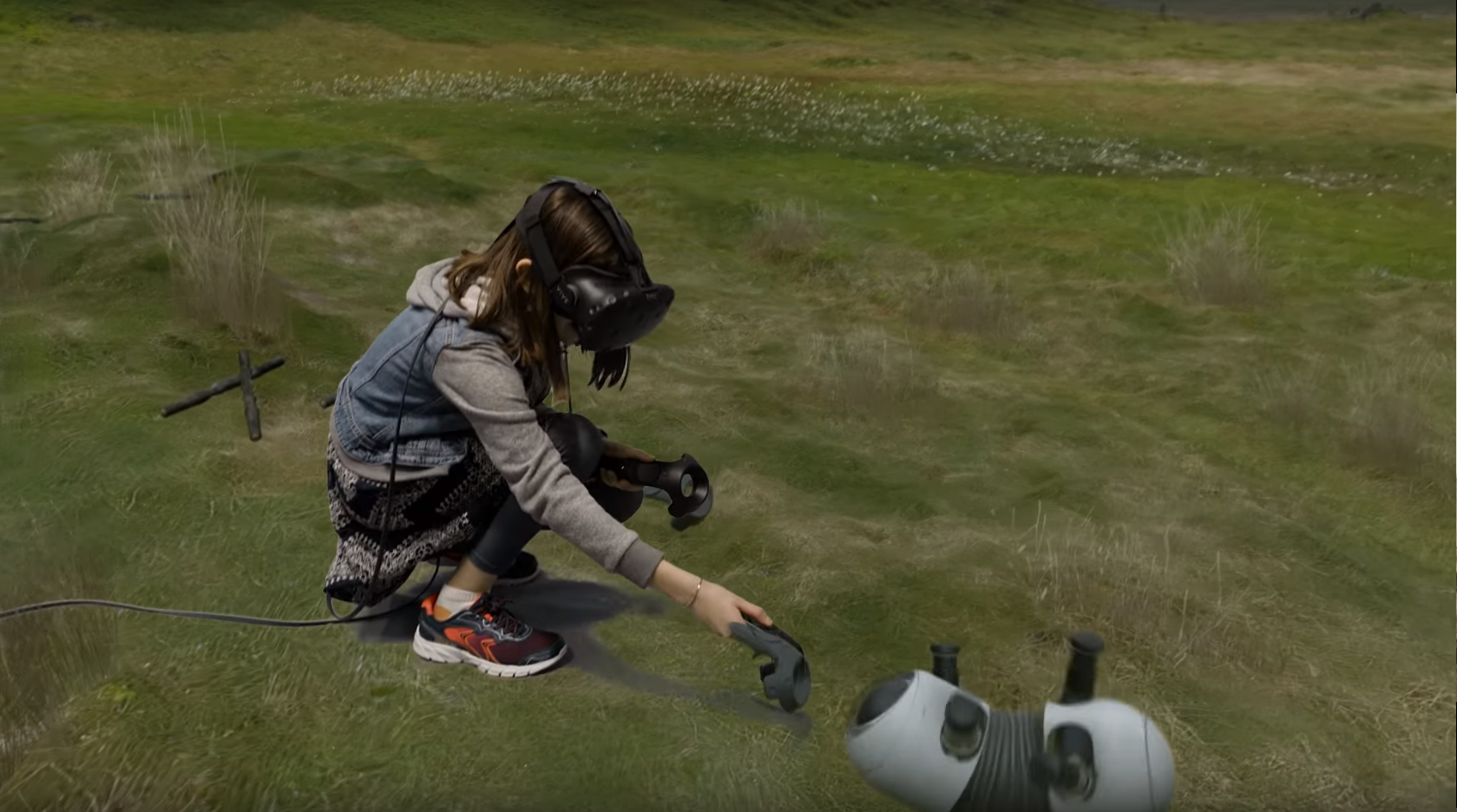 Girl in VR petting a robot dog